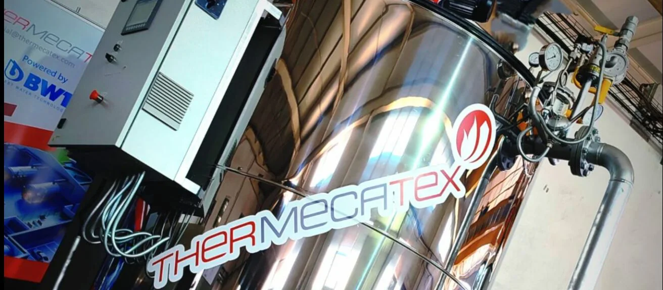 Chaudière à fluide thermique Thermecatex en inox poli avec armoire de commande